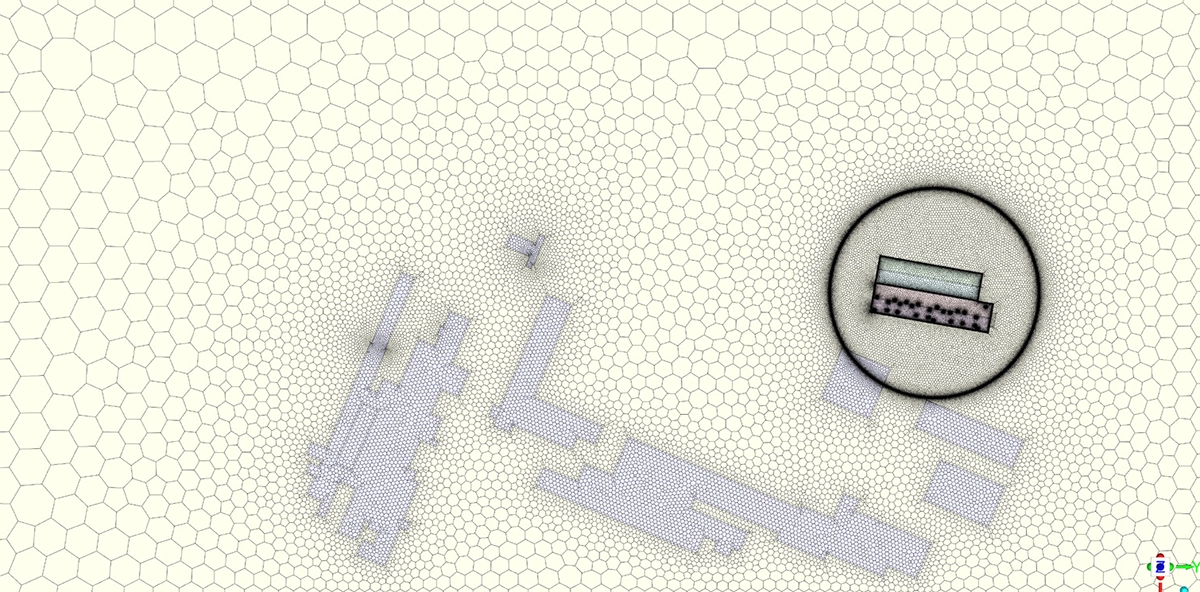 Top view of the polyhedral CFD mesh showing the warehouse with 25 roof windows and the adjacent terminal building